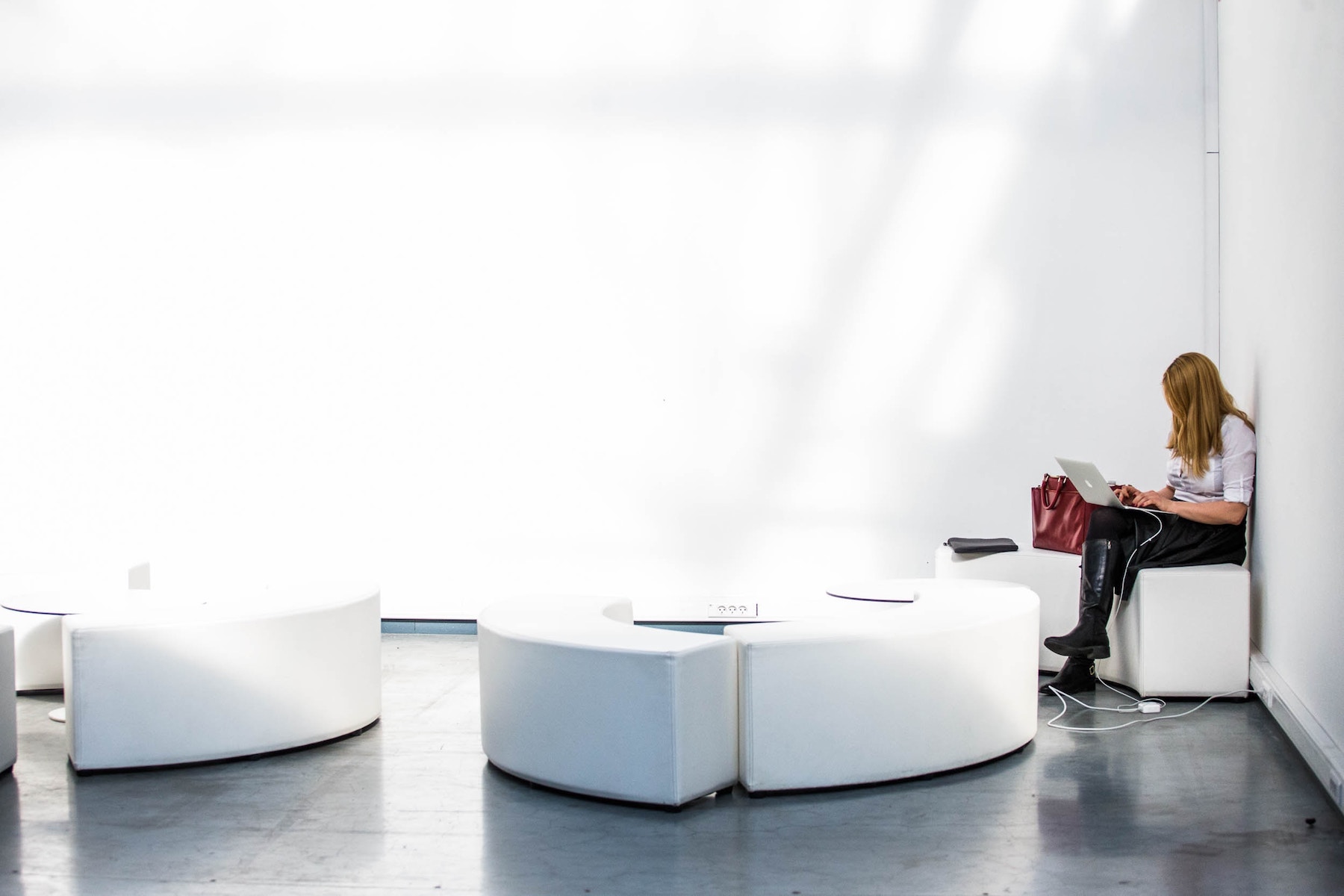 Female professional worker on her computer in an open office